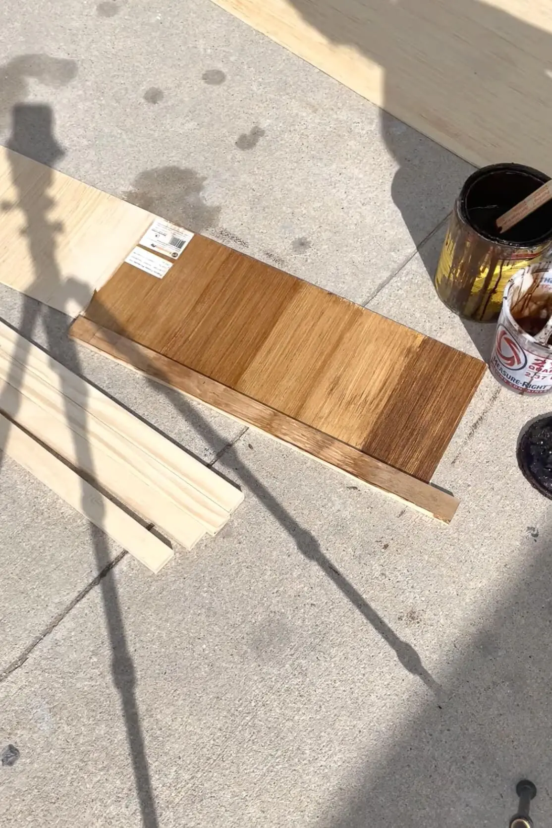Testing stains before applying to a board and batten bathroom wall. 